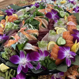 Fresh Sushi garnished with orchids