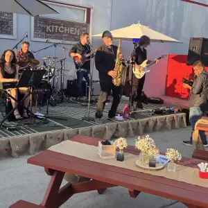 Tables set up to enjoy sampling food while listening to the live band.