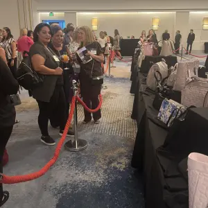 Ladies checking out the selection of purses
