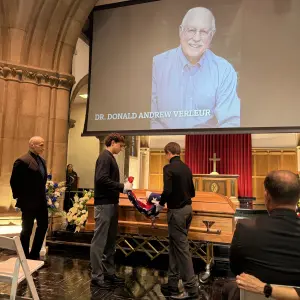 Grandkids fold the flag