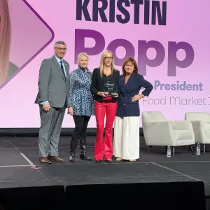 Kristen Popp receiving the WGA Woman of the Year award