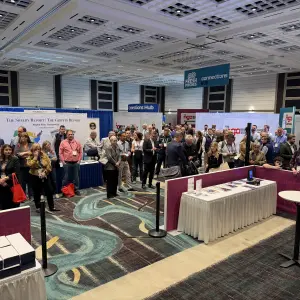 Independent grocer gather and wait for the opening of the ceremony