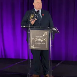 Mike Callihan, Food 4 Less receiving the Olive Crest Founders Award