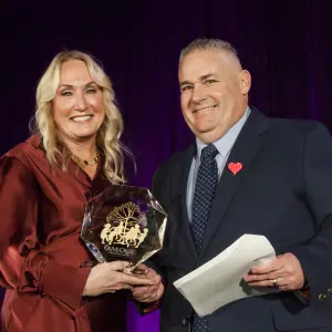 Rhonda Tagge presenting Mike Callihan with the Founders Award