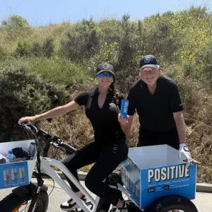 Shannon Argyros offering samples via her electric bike to golfers all over the course.