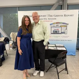 Kendra visiting the Shelby Report booth