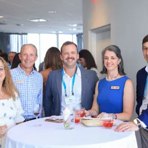 CFIC Executive Director Lindsey Kueffner (in blue) with platinum sponsors at their reception.