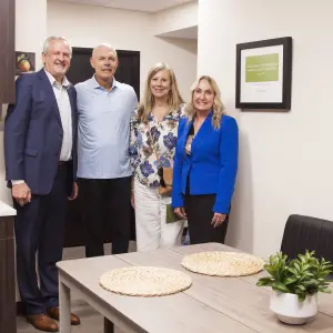 Donald Jr, Dave and Julie Hirz with Rhonda Tagge in the Dave Hirz Family Foundation Kitchen.