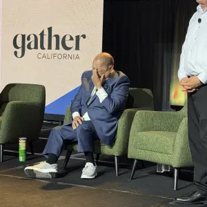 Ron Fong succoms to the emotion of retirement when given a standing ovation by the audience.