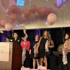Auctioning a surprise gift bag and asking for donations